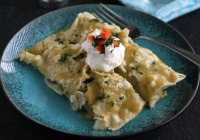 Chicken enchiladas with black beans, corn and red pepper 