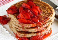 Whole wheat pancakes with fresh strawberry sauce