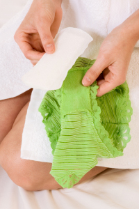 Woman attaching pantyliner
