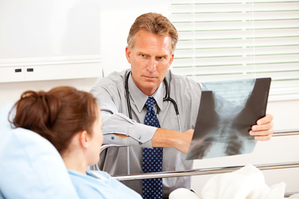 Woman having discussion with doctor