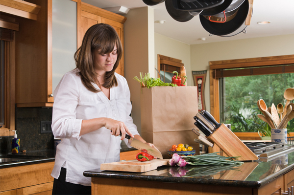 Woman with wooden cutting board