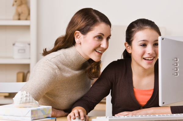 Mom and tween researching on internet