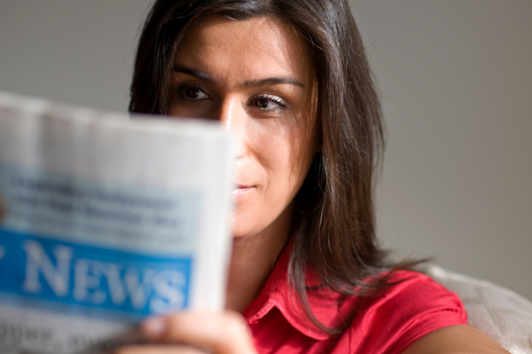Mom reading newspaper