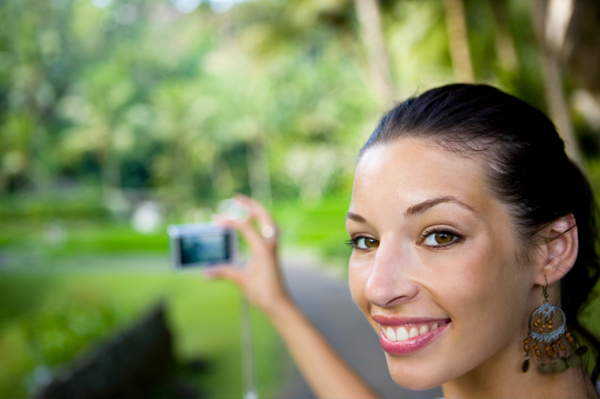 Woman with point and shoot camera