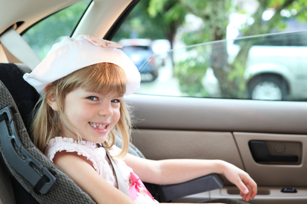 Young girl in booster seat