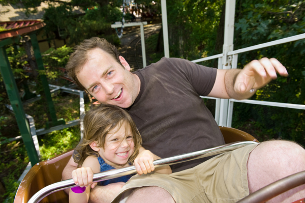 Dad and daughter at amusement park