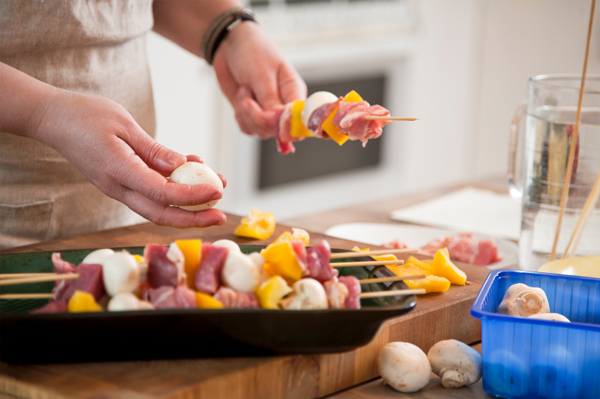 Woman bbqing veggies