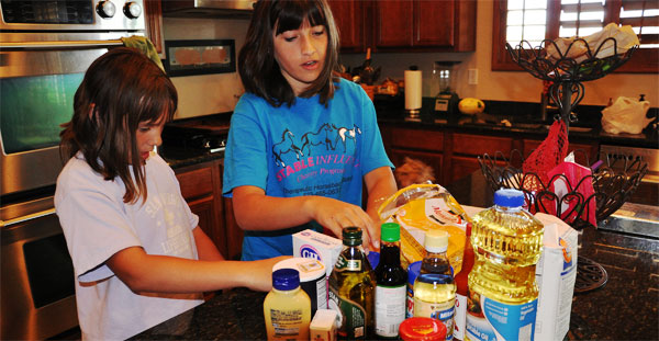 two kids cooking