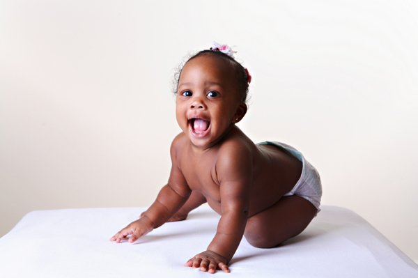 Laughing baby in a diaper