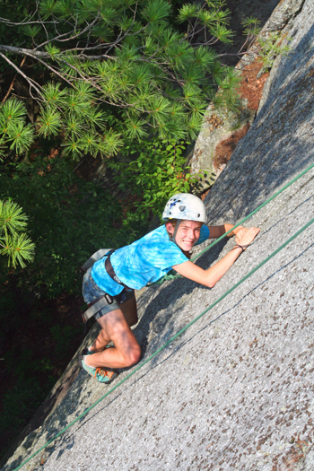 Boy Climbing Mountain