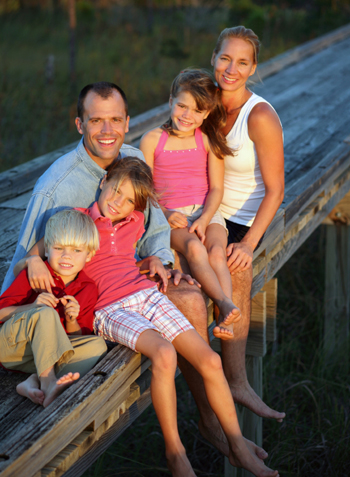Family relaxing on dock