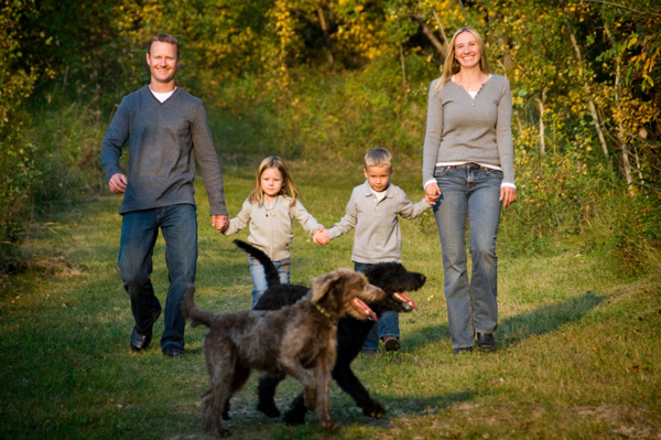 happy, healthy kids walking with dog