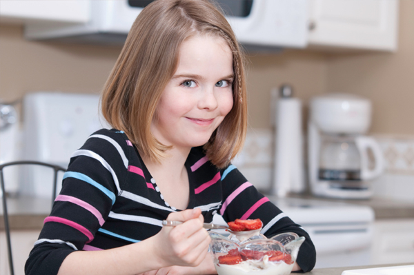 Girl eating breakfast