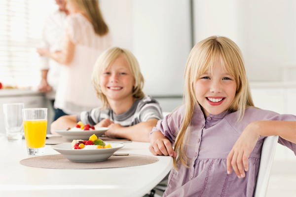Kids eating greek yogurt