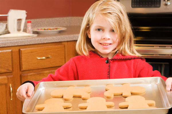 Little girl holding cookies