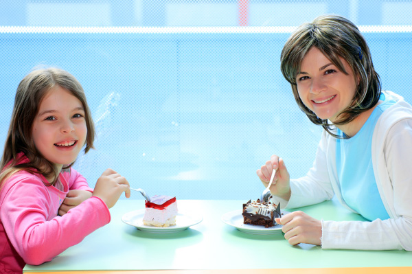 Mom and daughter bonding over cake