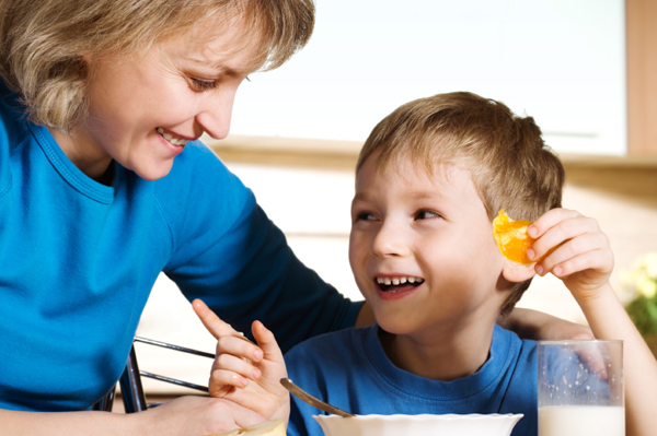 Mom and son at breafkast table