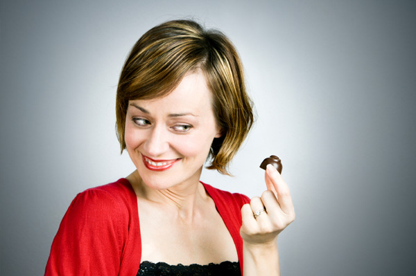 Woman looking at dark chocolate