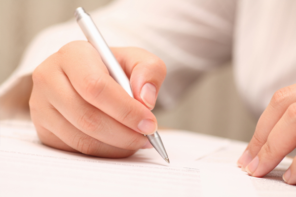 Woman signing contract