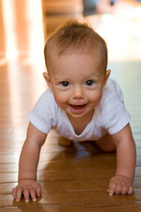 Baby crawling on floor
