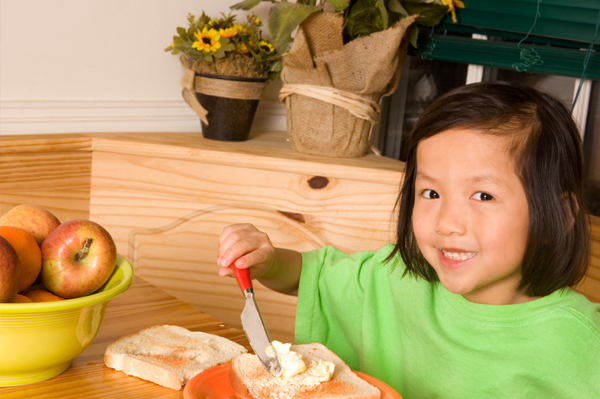 Child making toast