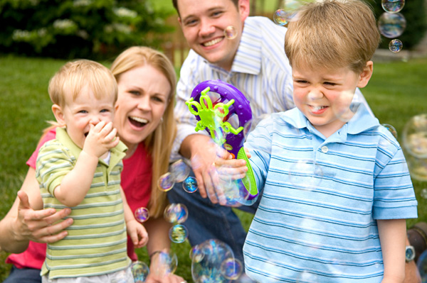 Family blowing bubbles