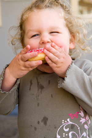 Little girl with donut
