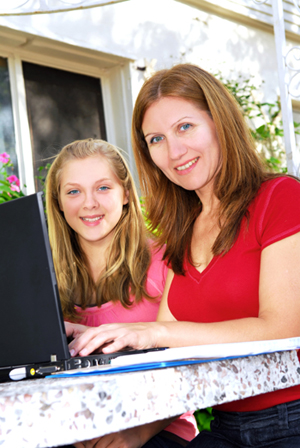 Woman outside with laptop