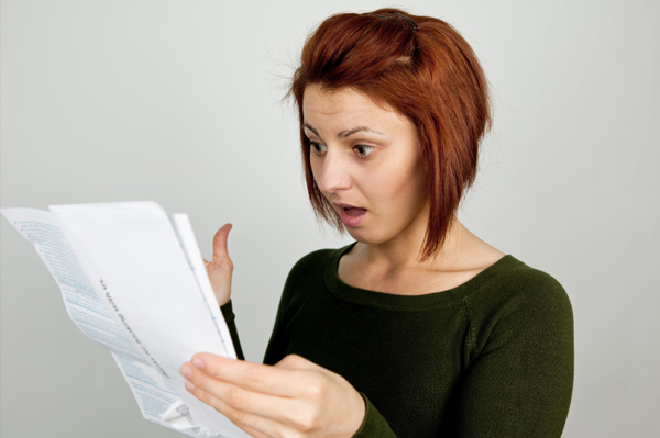 Woman reading credit report