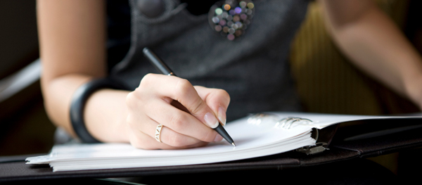 Woman writing a note