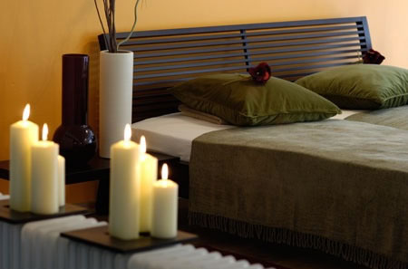 Candles are a very calming accent to any bedroom.