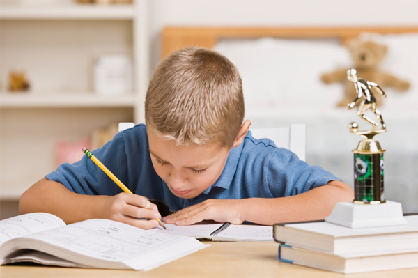 Boy studying in bedroom
