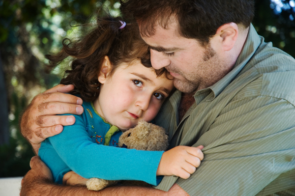 dad holding his daughter
