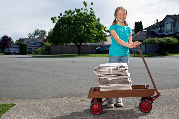 Girl delivering nespaper