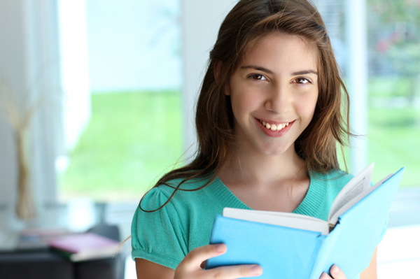 Girl reading a textbook