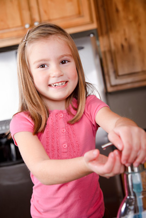 Little girl washing hands