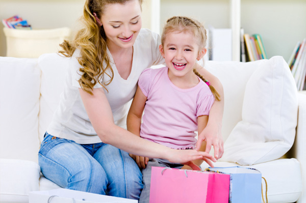 Mom and little girl with shopping bags
