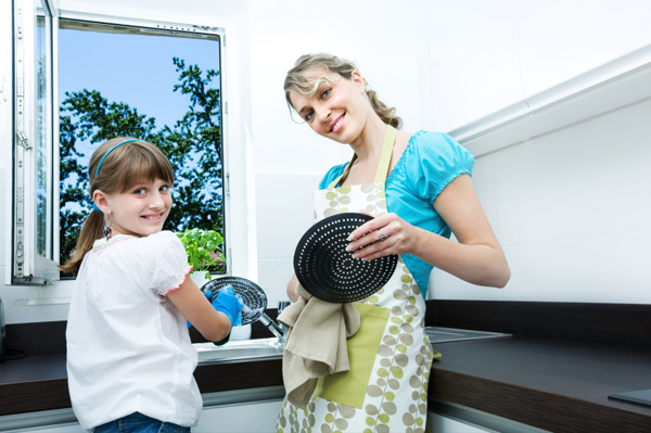 mother and daughter doing dishes