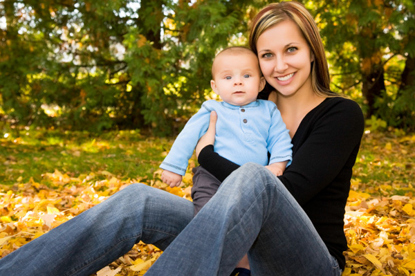 New mom with baby in fall