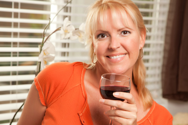 Woman drinking glass of red wine