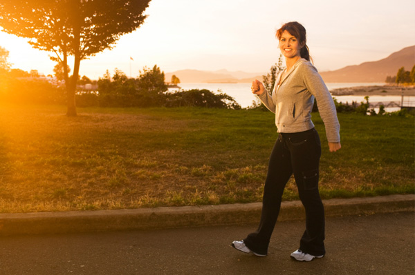 Woman going for walk at dawn