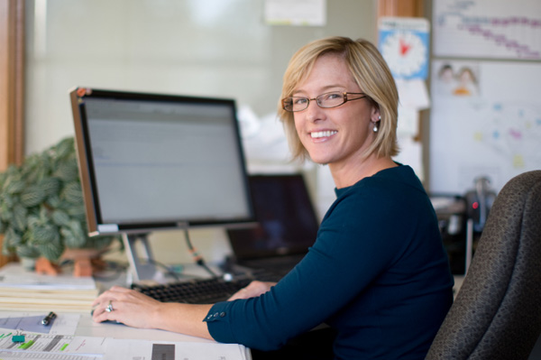 woman checking email at work