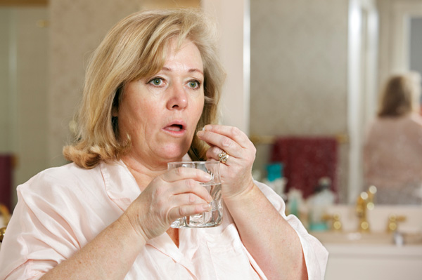 Woman taking medication
