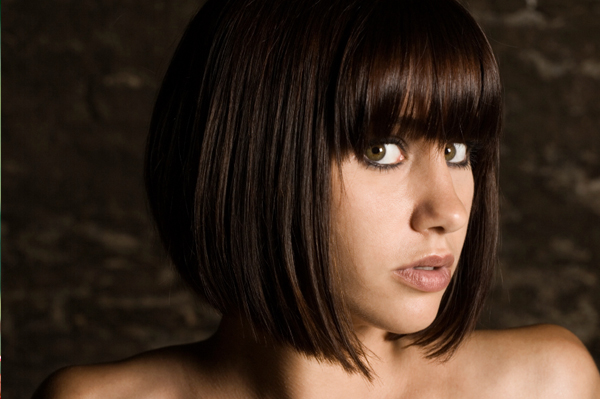 long hair with bangs round face. Woman with angs