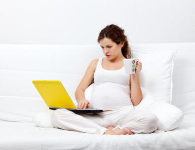 Pregnant mom on computer
