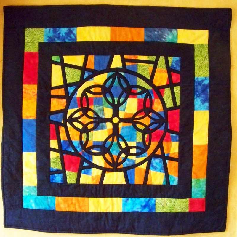 Kennedy uses American quilting techniques, such as Stained Glass Windows, in many of her pieces.