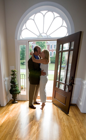 Couple kissing goodbye