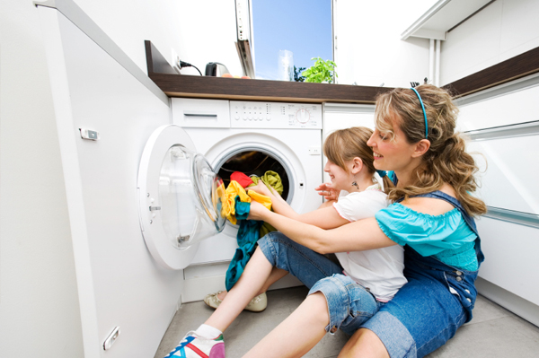 Mom and daughter doing laundry