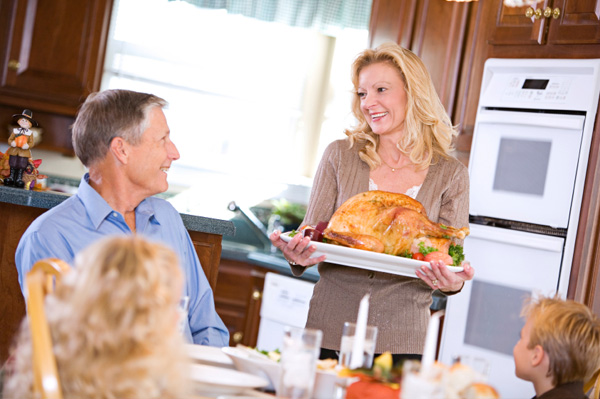 Woman serving Thanksgiving dinner