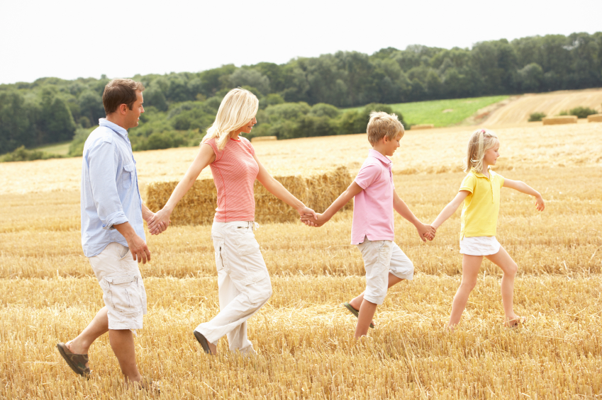 Family walking in field